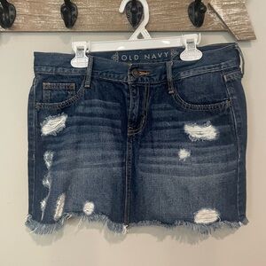 Old Navy mini Denim skirt. Dark washed distressed denim.